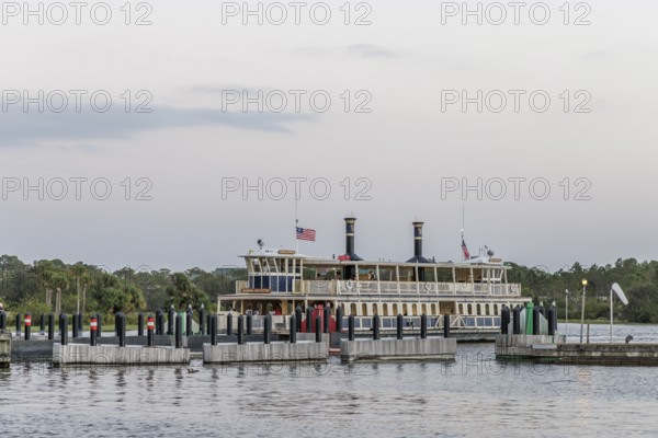 Water taxi General Joe Potter with passengers approaching the dock at the Magic Kingdom in Walt