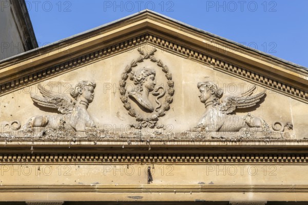Stonework details pediment above entrance to King's and Queen's Baths, city of Bath, north east