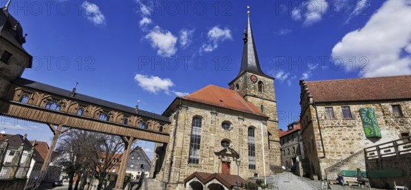 The Protestant-Lutheran St Laurentius Church with the bridge leading to the castle in Thurnau,