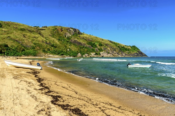 Speedboats in the sea at Bonete beach on Ilhabela island on the north coast of Sao Paulo, Ilhabela,