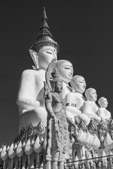 Five-headed Buddha statue, black and white photo, Wat Phra That Sorn Kaew Buddhist temple complex,