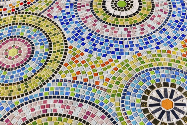 Floor covering decorated with small, colorful stone tiles, Buddhist temple complex Wat Phra That