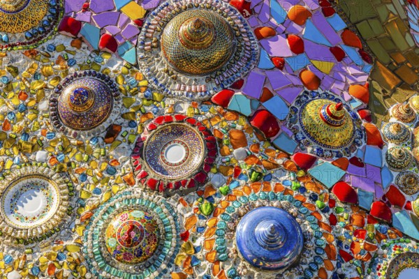Wall covering with colorful mosaic tiles and incorporated bowls, Buddhist temple complex Wat Phra