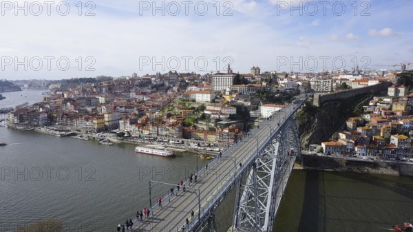 View from above of the metal bridge Ponte dom Luis across the Douro in Porto of a city with bridge
