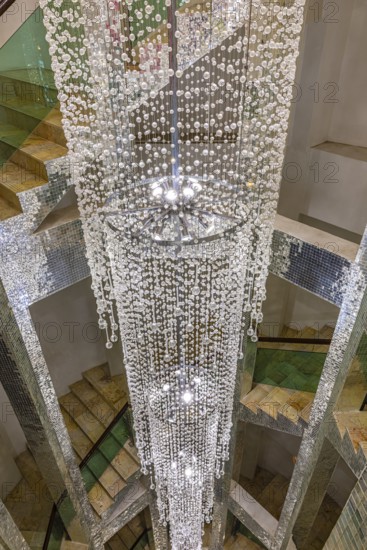 Lamp decorated with glass beads in the stairwell, Buddhist temple complex Wat Phra That Sorn Kaew,