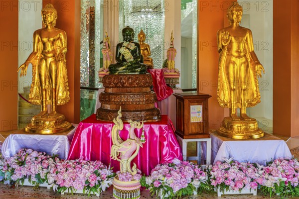 Shrine with gilded Buddhist statues in the main pagoda, Wat Phra That Sorn Kaew Buddhist temple