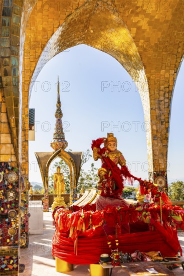 Round arch pavilions decorated with colorful mosaics and glass works of art, including a gilded