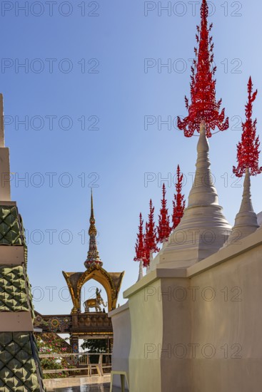 Red decorated tops of a temple complex, Buddhist temple complex Wat Phra That Sorn Kaew, Phetchabun