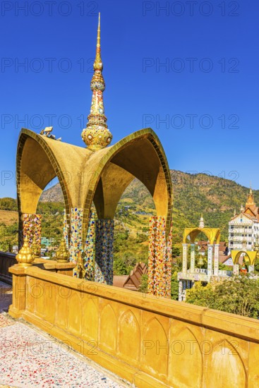 Round arch pavilion decorated with colorful mosaics and glass works of art, Wat Phra That Sorn Kaew