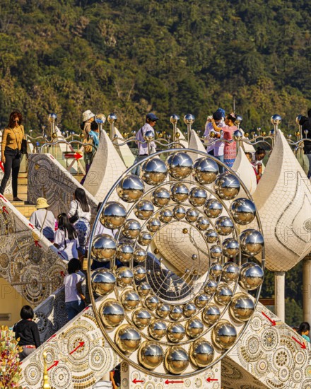 Visitors on the pedestal structure of the five-headed Buddha statue, Wat Phra That Sorn Kaew