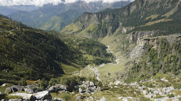Landscape with low-lying valleys and a forested mountain range on the Manali-Leh Highway, Trekking