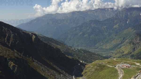 Wide mountain landscape with valleys under a cloudy sky, trekking in Ladakh, Manali-Leh Highway,