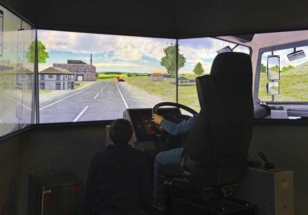 Truck simulator with children at DASA, German Occupational Safety Exhibition, Dortmund, Ruhr area,