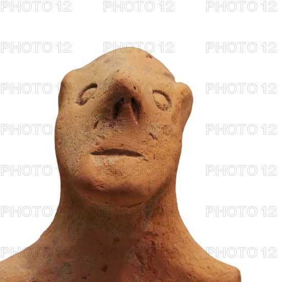 Anthropomorphic votive statuette, clay figure with abstract animal form, simple design and earthy