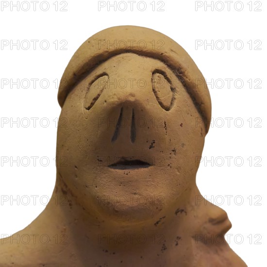 Anthropomorphic votive statuette, abstract clay figure with indicated headdress and simple details,