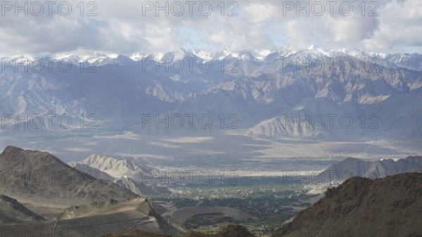 Majestic mountains with snowy peaks under a cloudy sky, Nubra Valley, trekking in Ladakh,