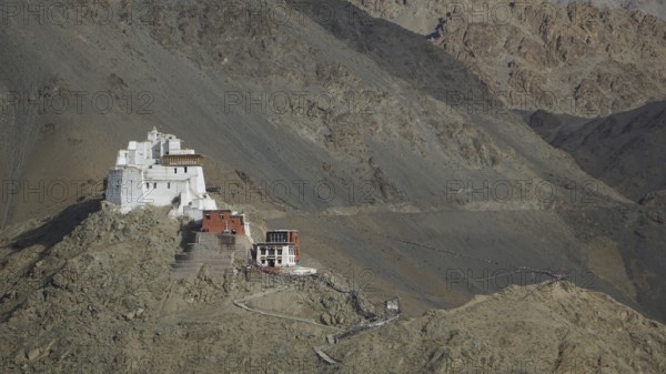 Hike to Namgyal Tsemo Buddhist monastery, perched on a rocky mountain in the midst of bare