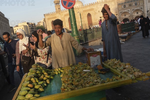 Cairo, Egypt. July 2nd 2024 A market stall holder selling prickly pear cactus fruit in the busy