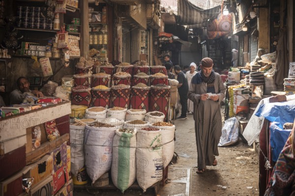 Cairo, Egypt. July 1st 2024 An Egyptian man walking in the narrow streets of the spice market a