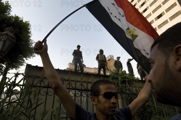 Cairo, Egypt. July 12th 2011 Protestors and armed guards outside the Shura Caouncil building,