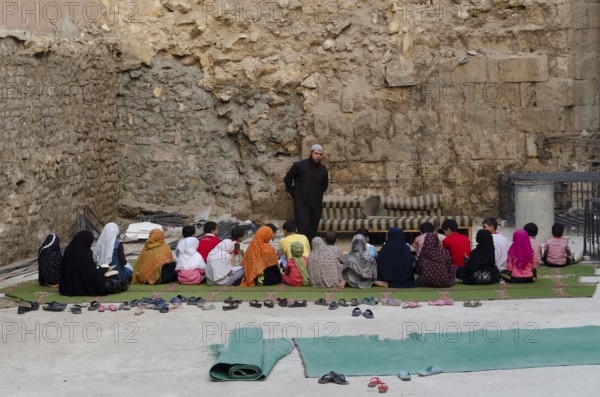 Cairo, Egypt. 21st October 2011 An open air school class and Muslim teacher giving lessons to