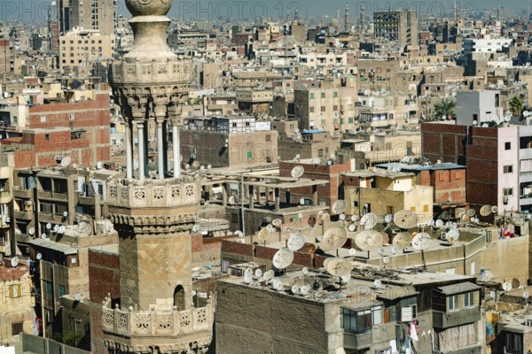 Cairo, Egypt. November 29th 2022 Mosque minaret in front of crowded aerial cityscape view of Cairo,