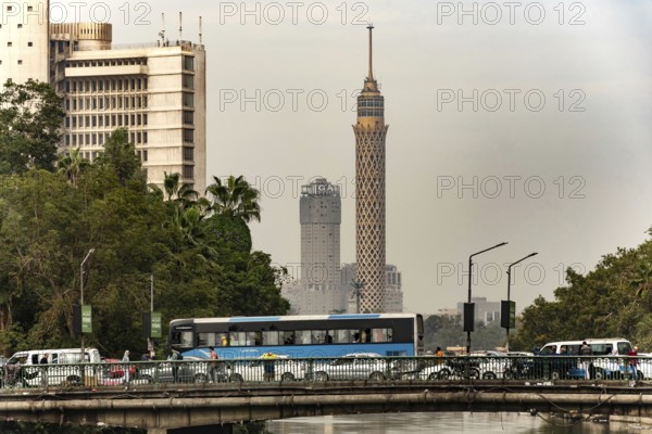 Cairo, Egypt, November 26th 2022 Egyptian commuter bus in traffic on a road bridge over the River