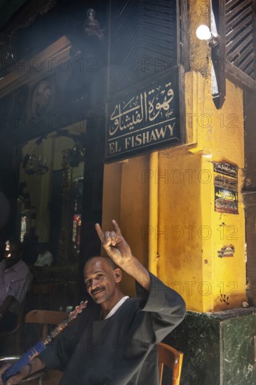 Cairo, Egypt. July 23rd 2011 An Egyptian man enjoying a shisha water pipe in the famous El Fishawy