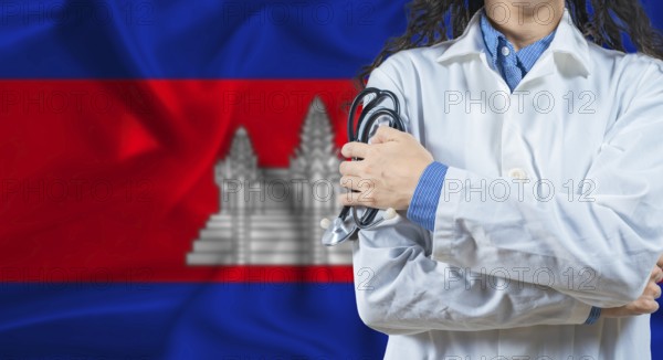 Healthcare professional with Cambodia flag background. Professional doctor holding stethoscope on
