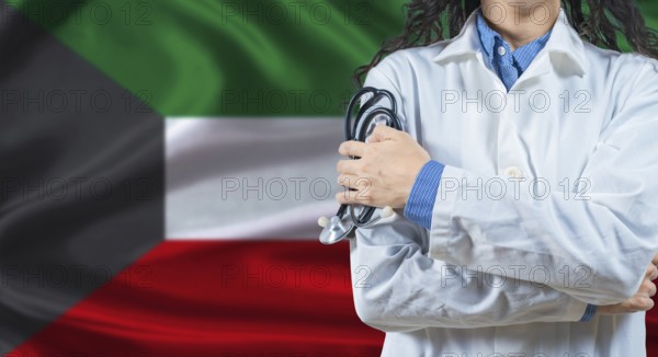 Healthcare professional with Kuwait flag background. Professional doctor holding stethoscope on