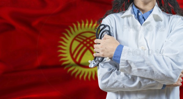 Healthcare professional with Kyrgyzstan flag background. Professional doctor holding stethoscope on