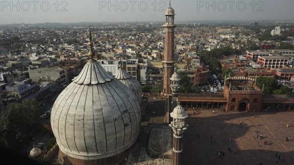 Jama Masjid mosque with minarets amidst a wide panoramic view of the city, Delhi, India