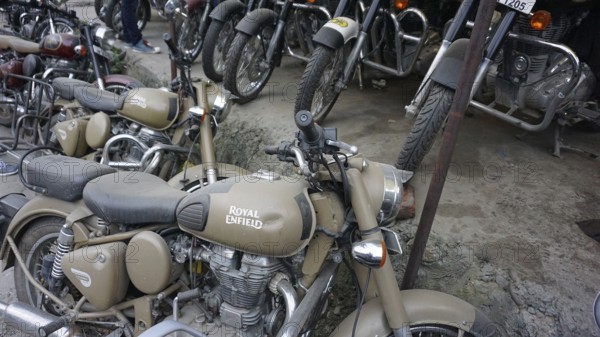 Various Royal Enfield motorcycles parked at a dealer, Manali, Himachal Pradesh, India