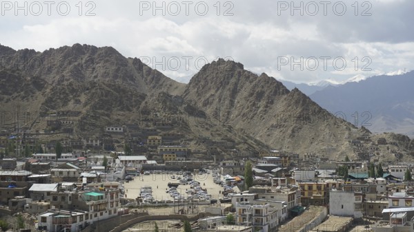 City view of Leh with mountains in the background under a cloudy sky, Ladakh, North India,