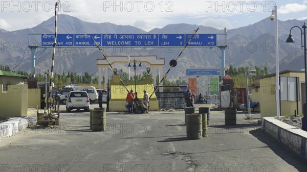 Entrance to Leh with a welcome sign and views of the surrounding mountains, Leh, Ladakh, North