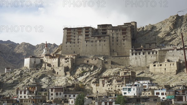 Historic fortress, Leh Palace on a rocky mountain in an urban setting, Leh, Ladakh, North India,