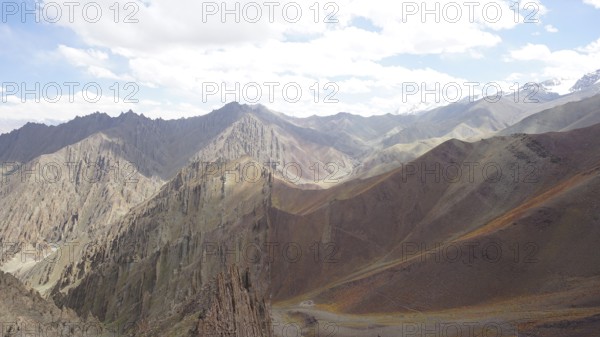 Mountain landscape with steep peaks and clear, beautifully illuminated area, trekking at Stok La