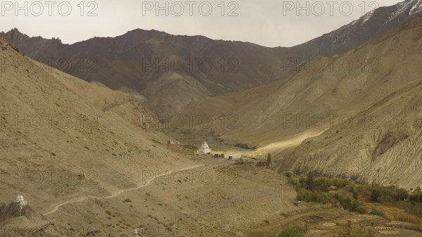 Wide valley with a trail in the midst of a majestic mountainous landscape, trekking in Ladakh,