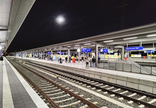 Empty platform at night with full moon, central railway station, Dortmund, Ruhr area, North