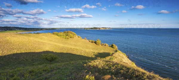 Hilly landscape in the Zicker Mountains, including Zicker Alps, view across the lagoon landscape to