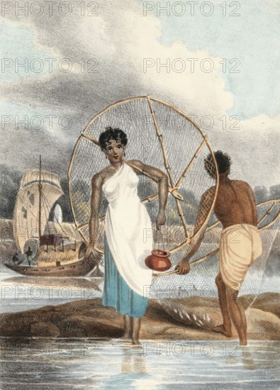 Fisherman and woman with net and small fish on shore, India, authentic, digitally restored