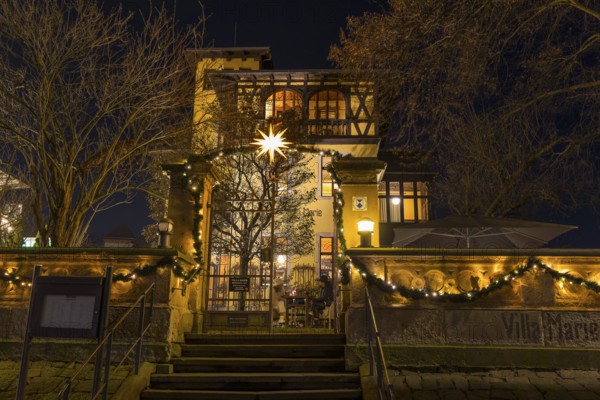 Atmospheric night view of the restaurant Villa Marie am Blauen Wunder with Christmas decoration,