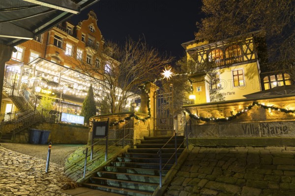 Atmospheric night view of the Cafe Toscana restaurant and Villa Marie am Blauen Wunder with