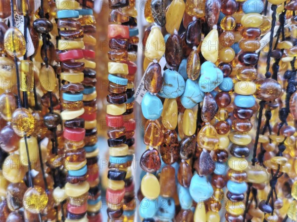 Close-up of amber and colorful gemstones and pearls in various colors, Baltic Sea, Danzig, Poland