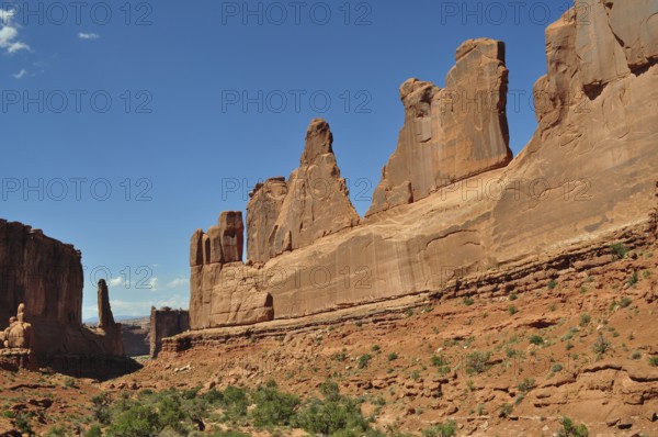 Majestic sandstone rocks, Wall Street, dominate the landscape under a clear sky, Arches National