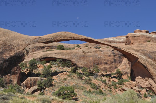 Landscape Arch, an imposing, far-reaching rock arch in a rocky desert environment, Arches National