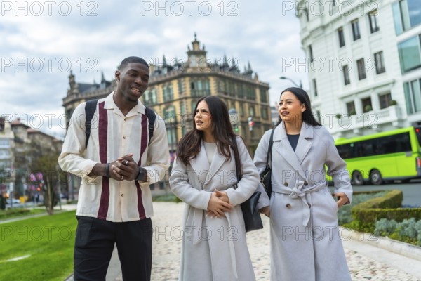 Diverse friends enjoying a casual walk through an urban park, engaging in conversation while