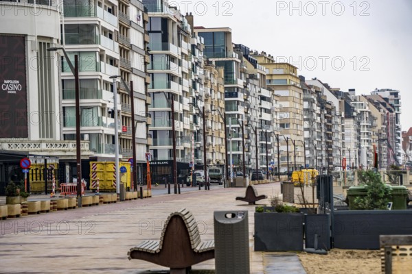 An urban promenade with modern high-rise buildings by the sea under cloudy sky, Zeedijk-Knokke,