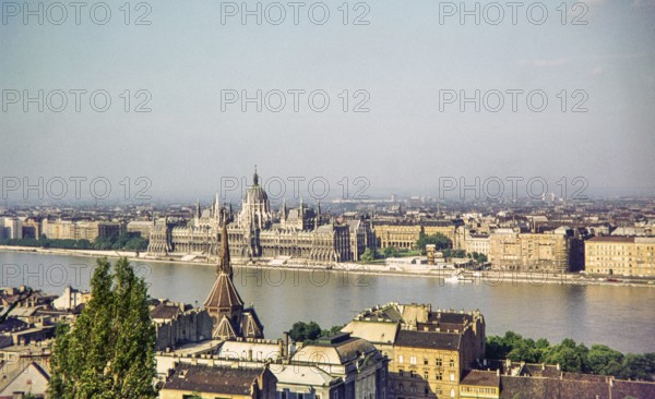 Cityscape view across Danube River from Buda to Pest, Hungarian Parliament Building, Budapest,