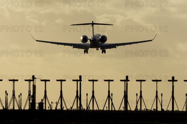 Gulfstream executive business jet aircraft in flight on approach to land at sunset at London